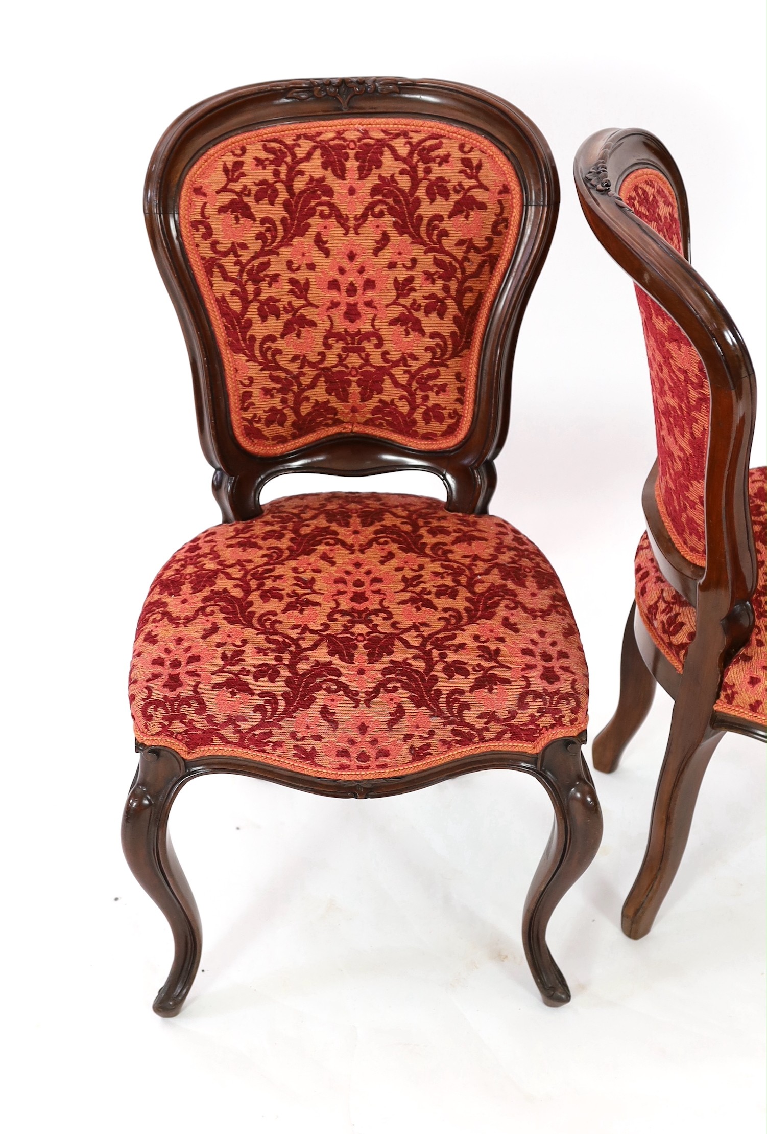 A set of twelve Victorian mahogany balloon back dining chairs, W.50cm D.46cm H.89cm